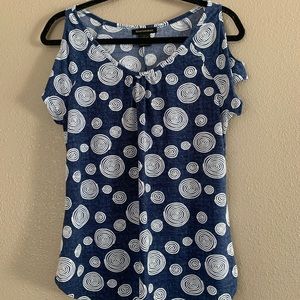 Blue shirt with embroidered white stitching and shoulder cut outs